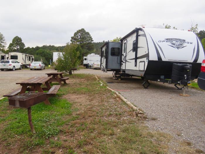 Charcoal Grill and Picnic Tables at Turquoise Trail Campground & RV Park Site 31