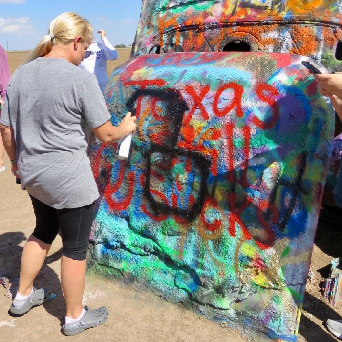 Spraying Support of the Texas Longhorns at Cadillac Ranch
