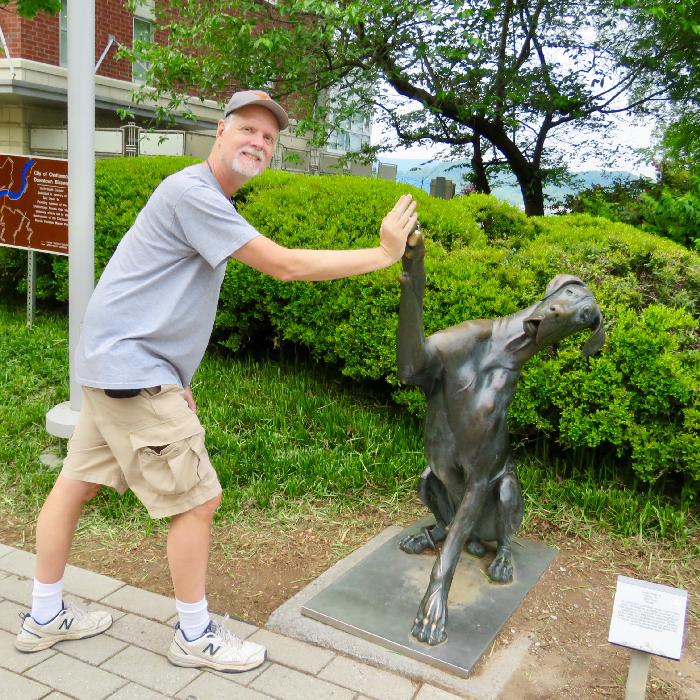 Scott Giving a High-Five to a Great Dane Sculpture on Chattanooga Riverwalk