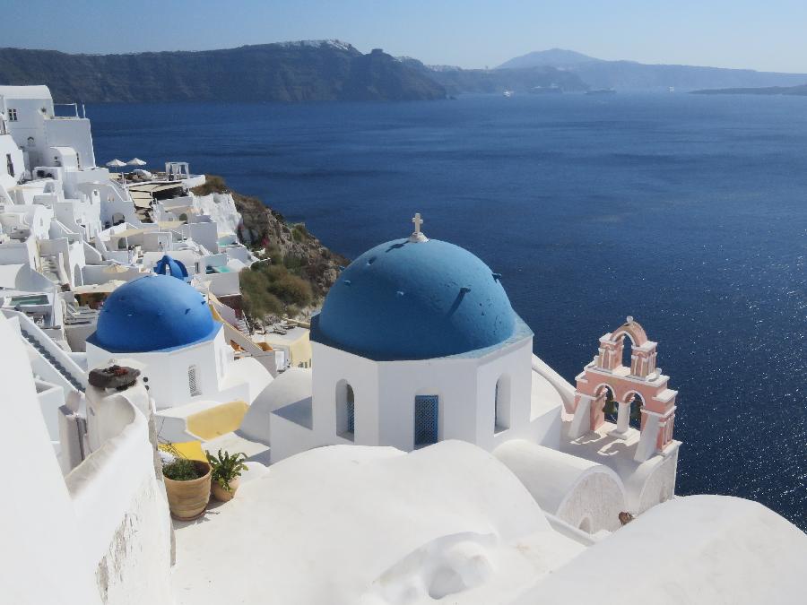 The Iconic Blue Domed Cliffside Churches of Santorini