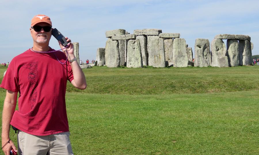 Listening to the Audio Guide at Stonehenge